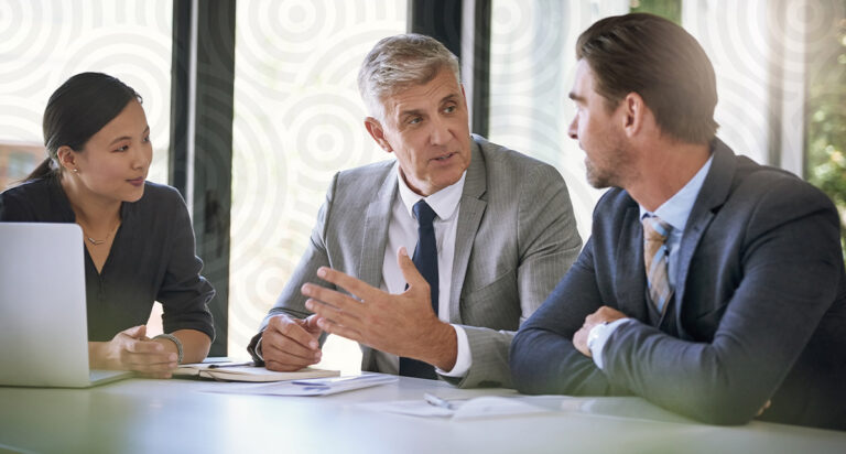 An advisor overviewing financial planning software with clients.