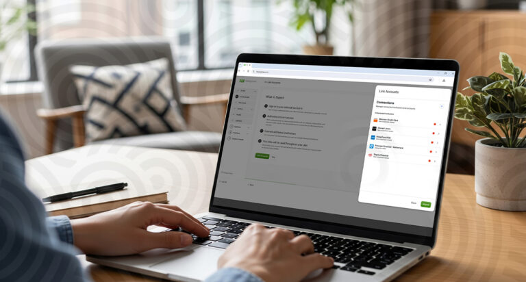 A person reevaluating their comprehensive financial planning software on a laptop.